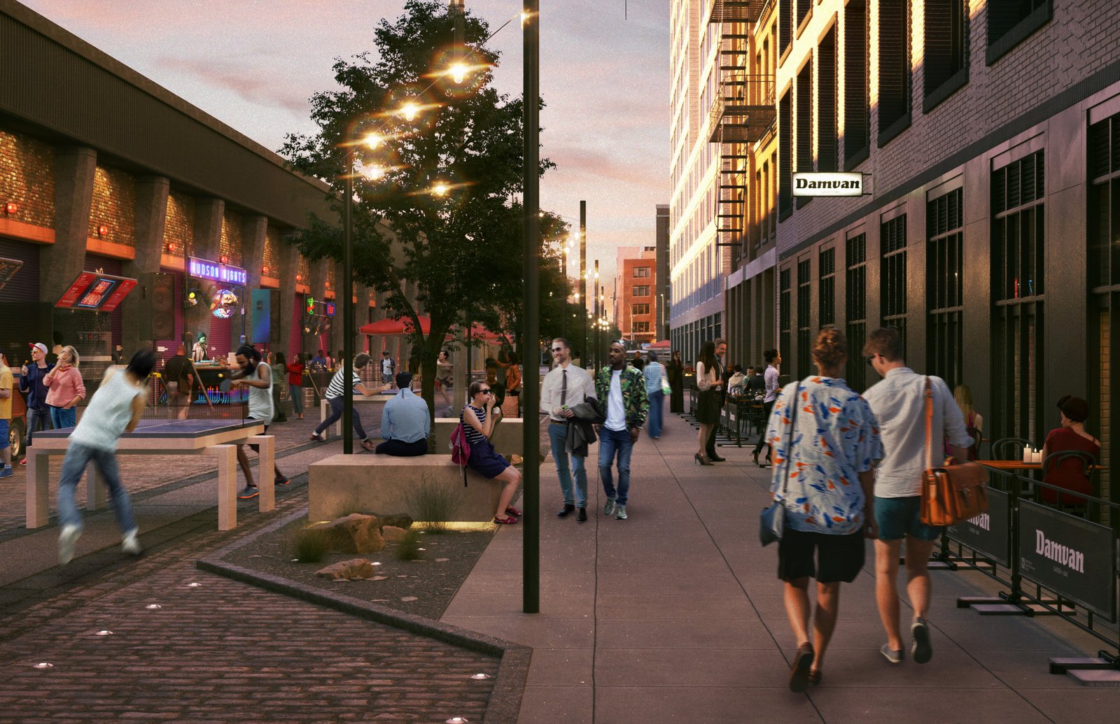 People walking along a lively street with tables, lights, and outdoor dining.