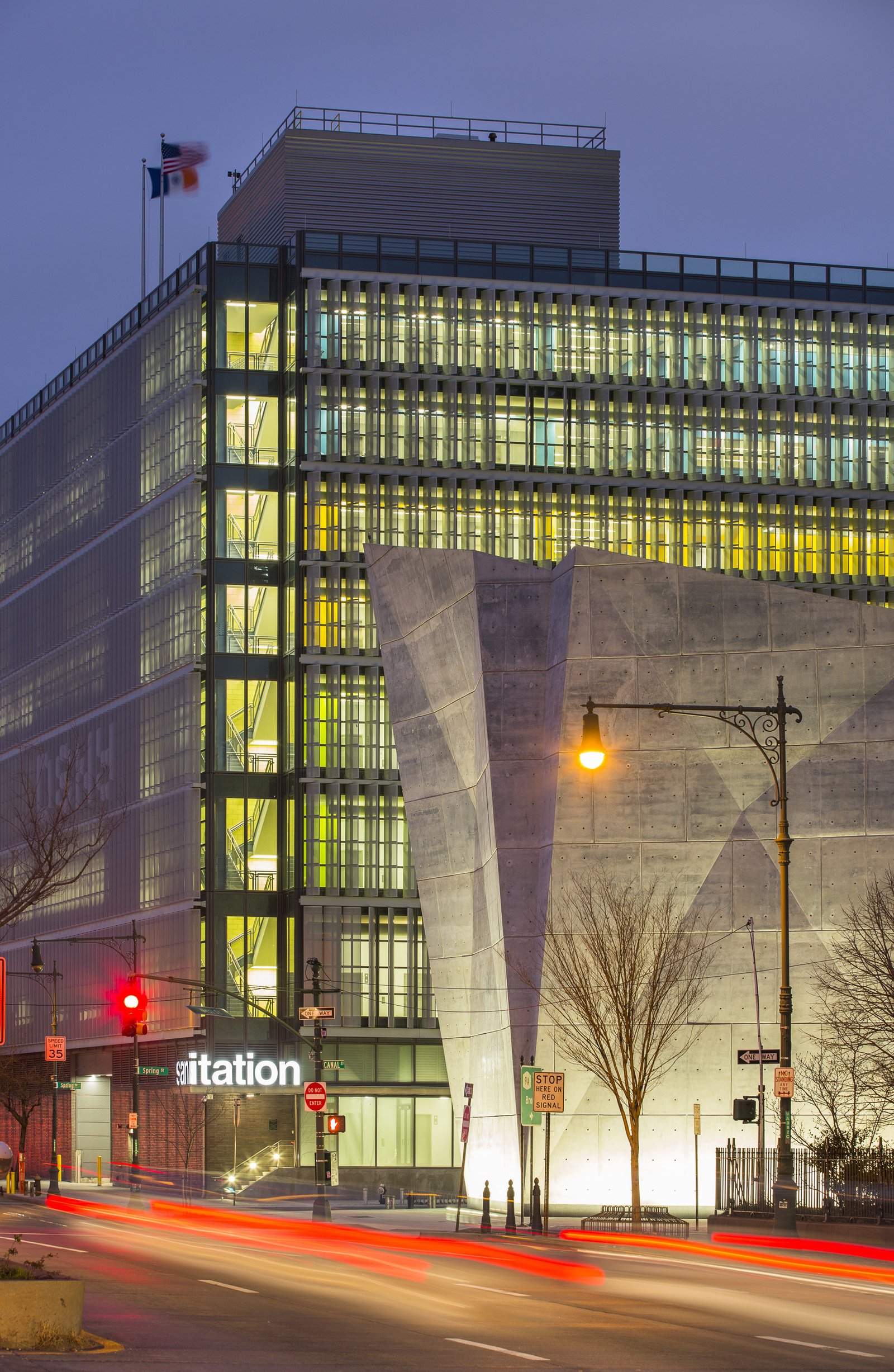 A close-up view of DSNY garage and Salt Shed, showcasing their contrasting architectural forms.