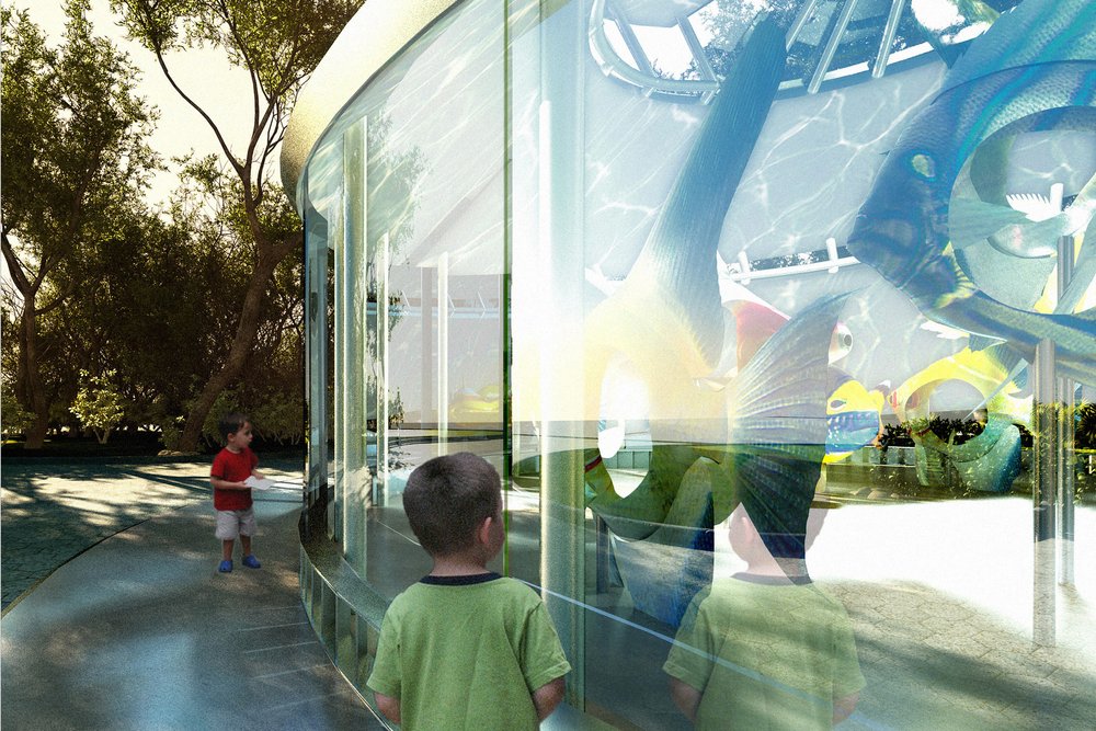 Children look through glass at vibrant fish sculptures inside the SeaGlass Carousel.