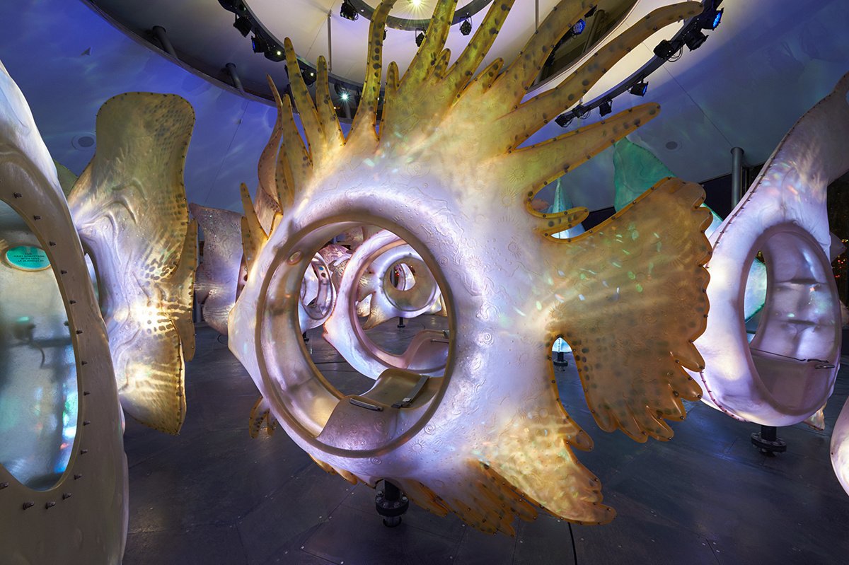 Close-up of illuminated fish sculptures inside SeaGlass Carousel.