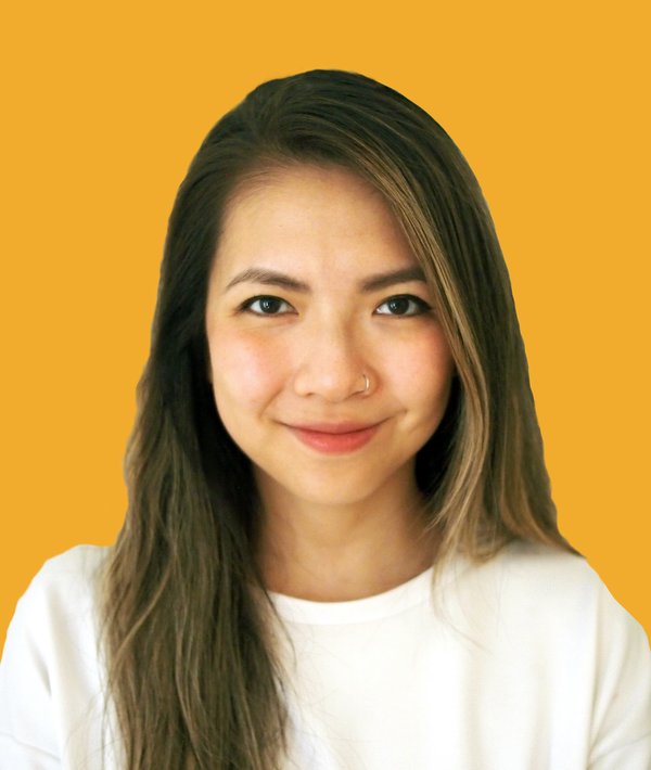 Headshot of Sijia Zhou in a white shirt with a yellow background.