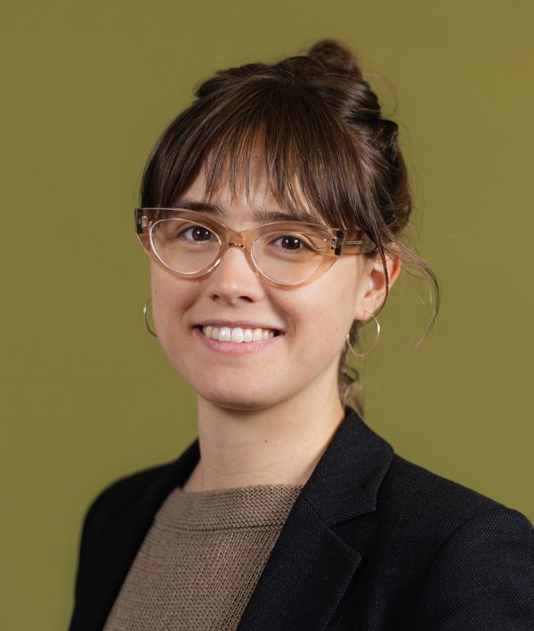 Headshot of Dare Brawley against a green background.