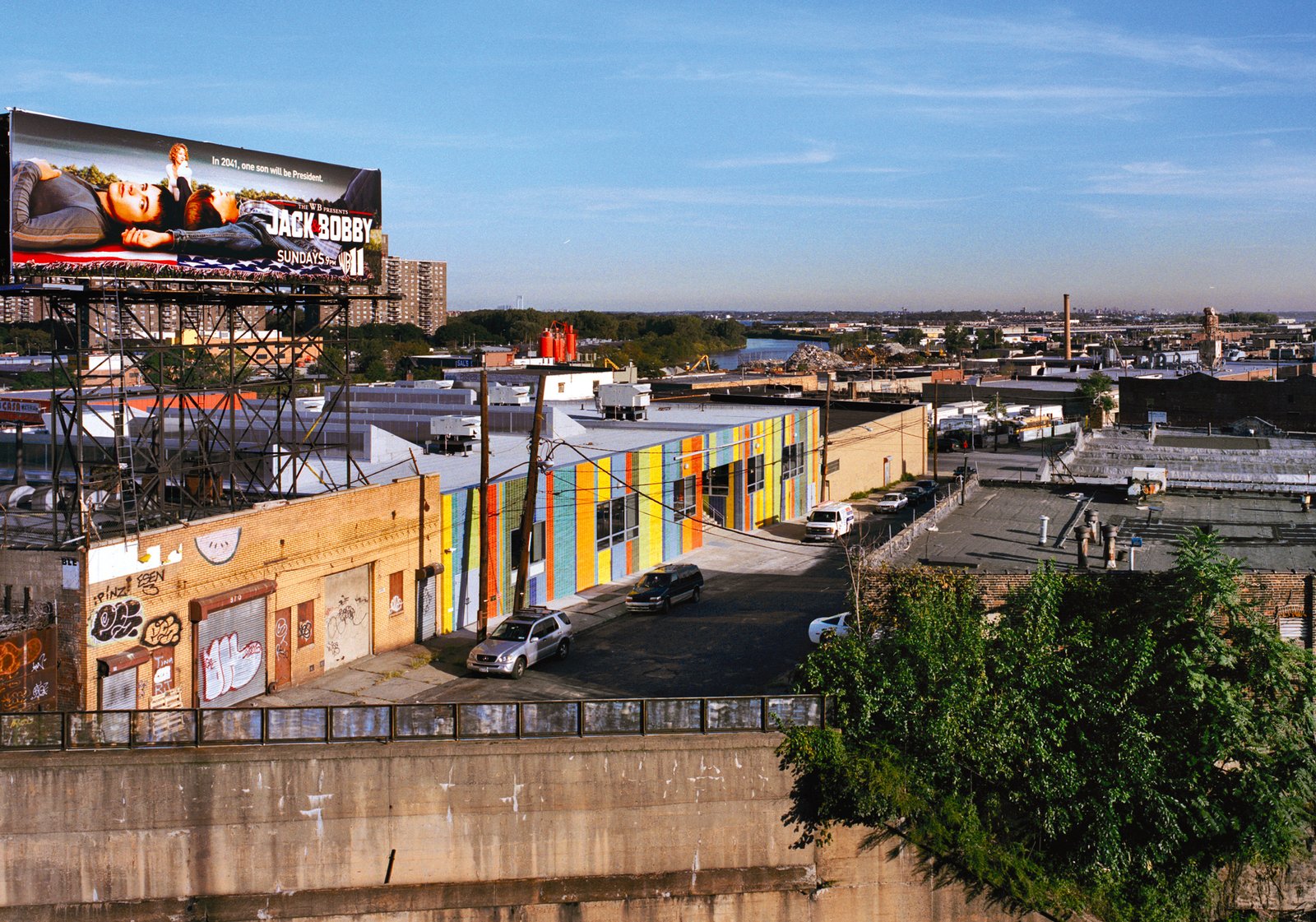 Colorful adaptive reuse school building in urban landscape.