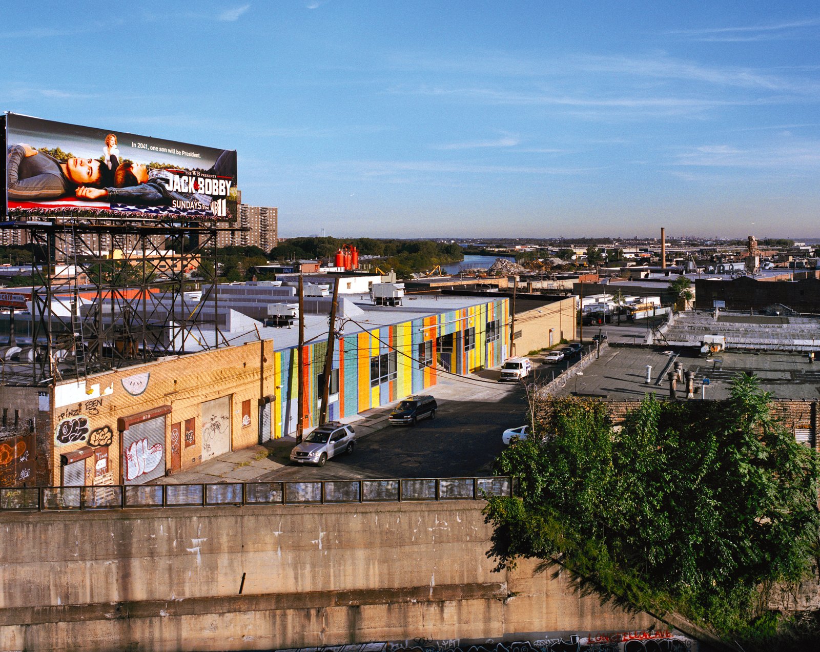 Colorful adaptive reuse school building in urban landscape.