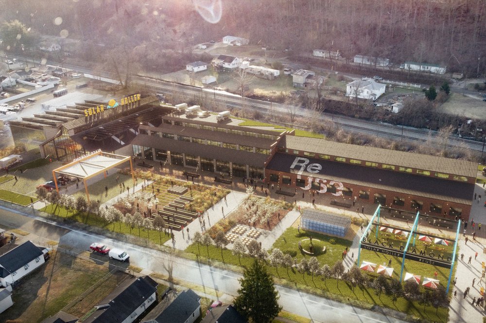 Aerial view of the Solar Holler building and surrounding gardens, featuring reused industrial materials.