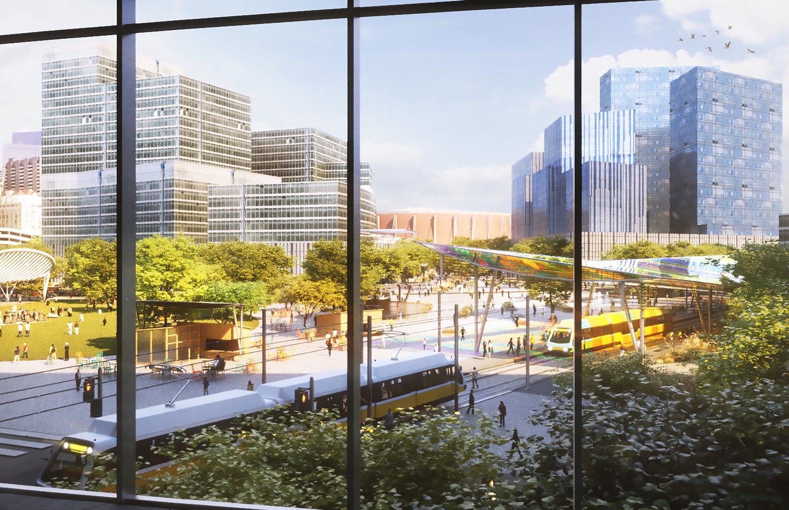 View through window of a bustling urban plaza with greenery, transit, and modern buildings.