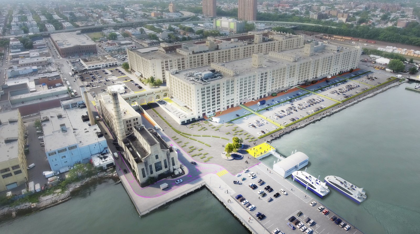 Aerial view of waterfront industrial complex with parking and ferry dock.