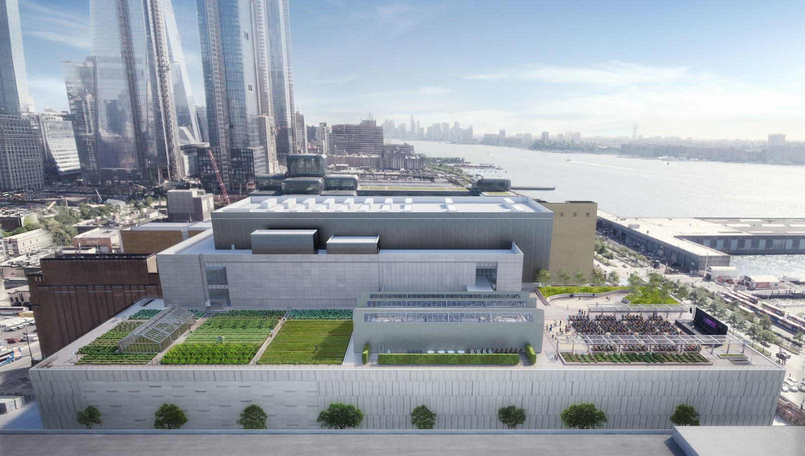 Javits Center with a rooftop garden sits along the waterfront, surrounded by tall skyscrapers and river views.