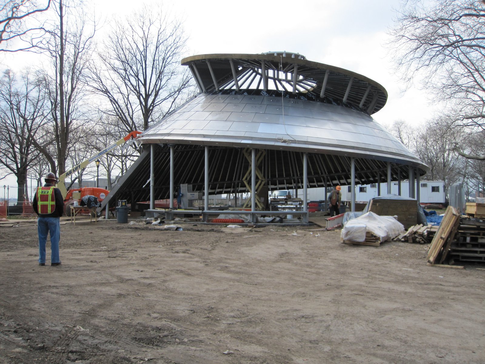 Construction of SeaGlass Carousel structure with workers and framework exposed.