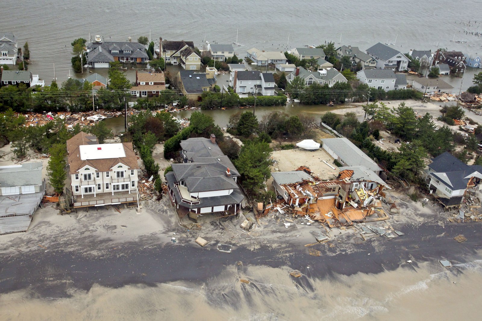 Aerial view of storm-damaged homes along the flooded New Jersey coastline.