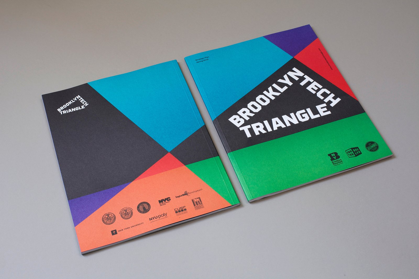 Two colorful Brooklyn Tech Triangle reports with geometric designs on the covers.