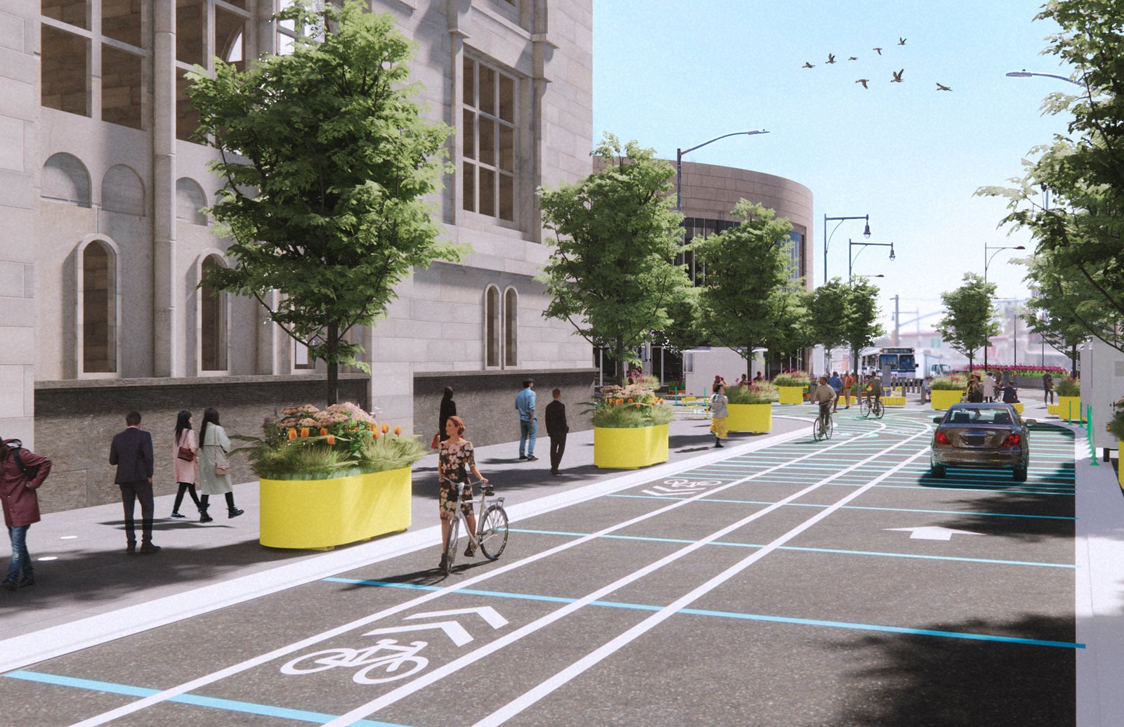 Street view with bike lanes, trees, and mixed pedestrian and vehicle space.