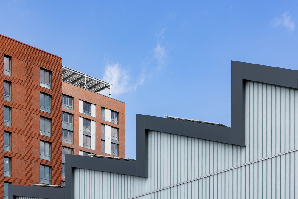 A view of the sawtooth-roofed industrial building at The Peninsula.