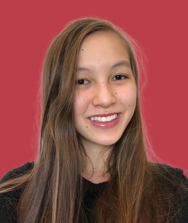 Headshot of Sarah Lohmar in a dark top against a red background.