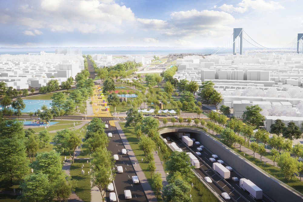 A green corridor with trees, pedestrian pathways, and a capped highway in a dense urban setting.