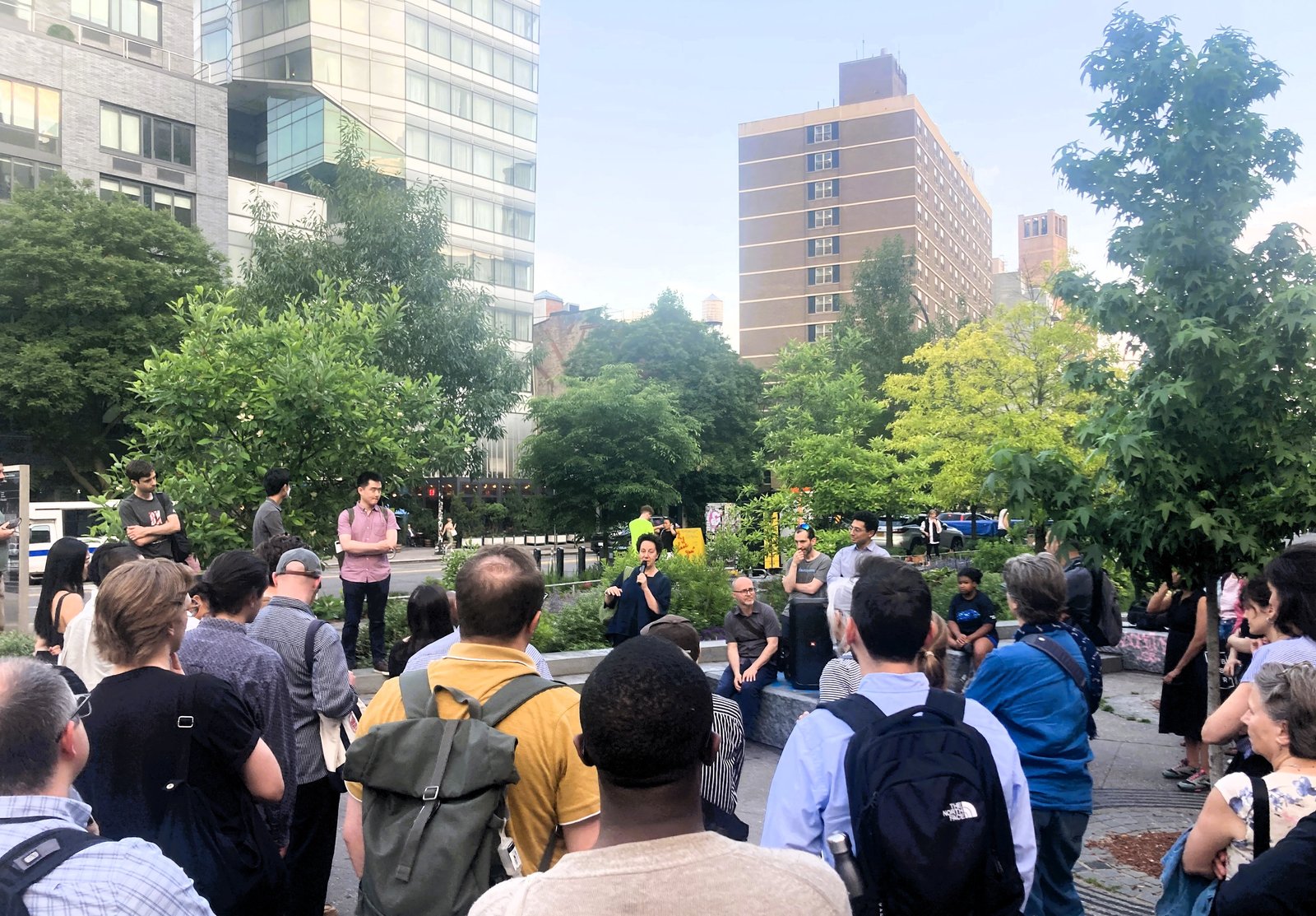 People gather in Cooper Square to discuss the evolving nature of New York City streets.