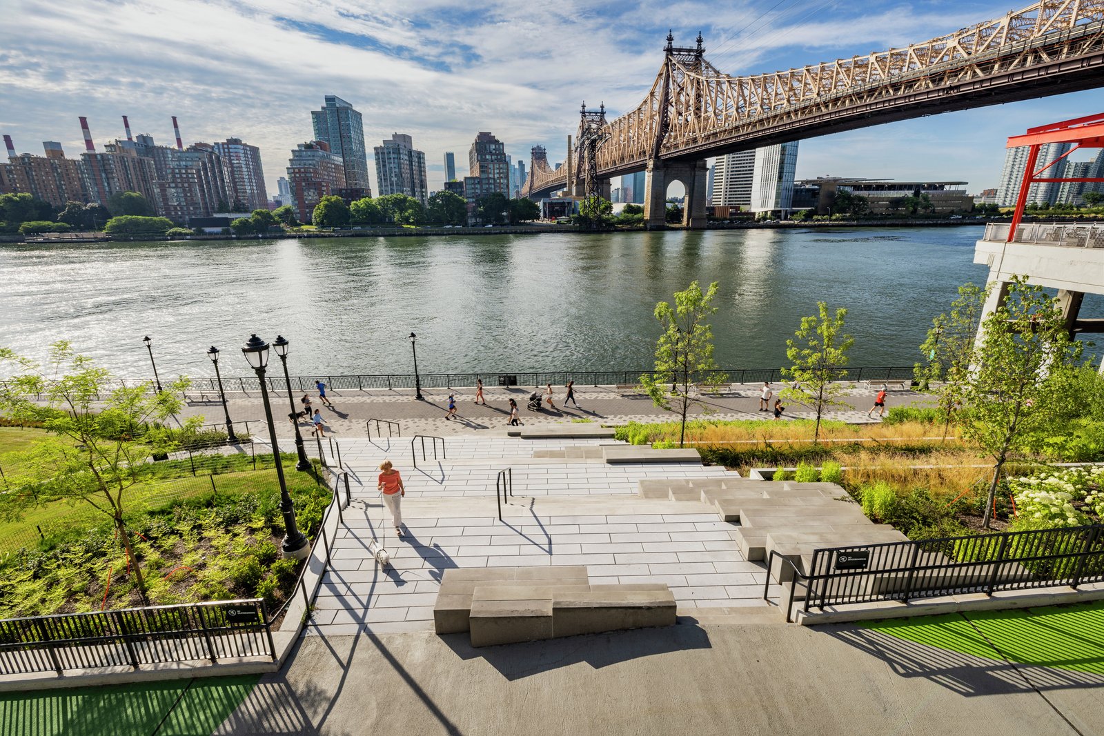 A wide staircase leads to East River waterfront with views across the East River.